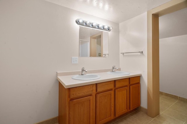 bathroom with tile patterned flooring and vanity