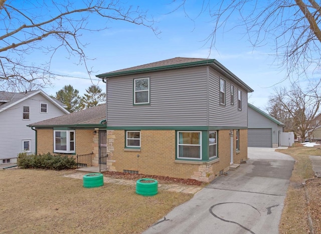 view of front facade featuring a garage and an outdoor structure