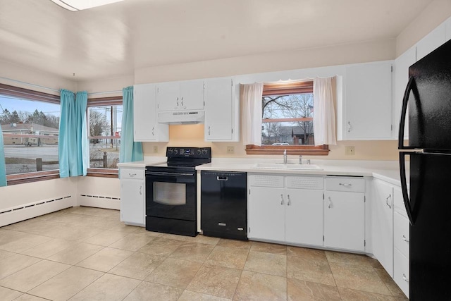 kitchen featuring sink, white cabinetry, baseboard heating, and black appliances