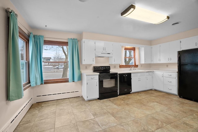 kitchen with white cabinets, a baseboard radiator, and black appliances