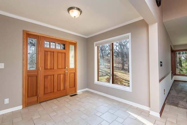 entrance foyer featuring ornamental molding