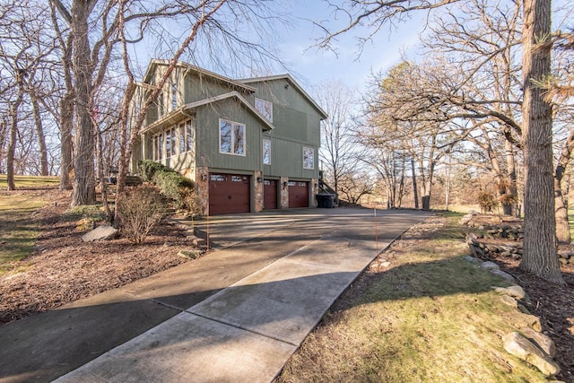 view of side of home featuring a garage