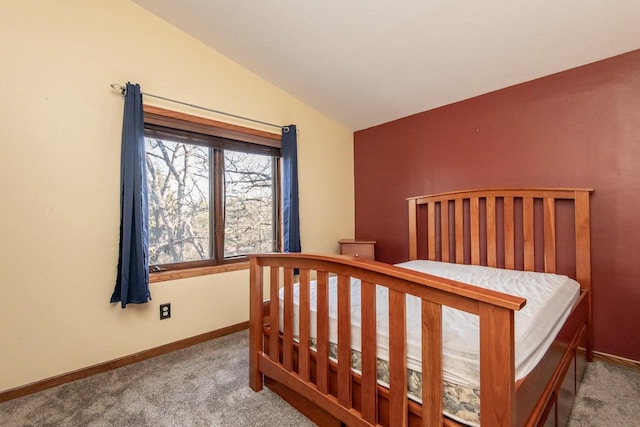 carpeted bedroom featuring vaulted ceiling