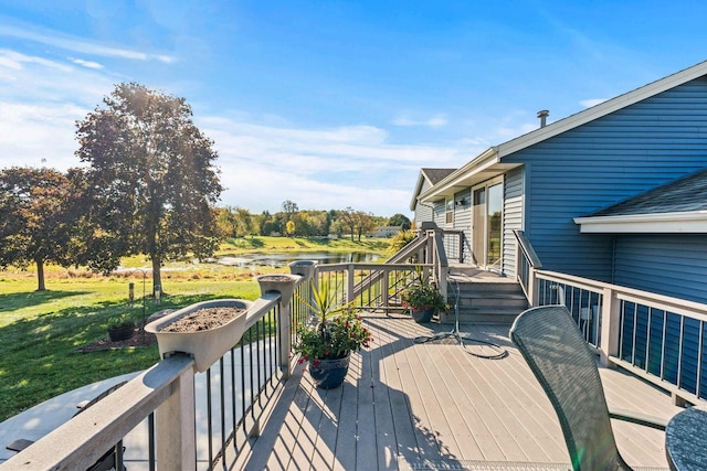 wooden terrace featuring a yard