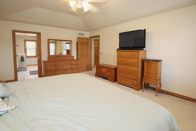 bedroom with carpet flooring, ceiling fan, a tray ceiling, and lofted ceiling