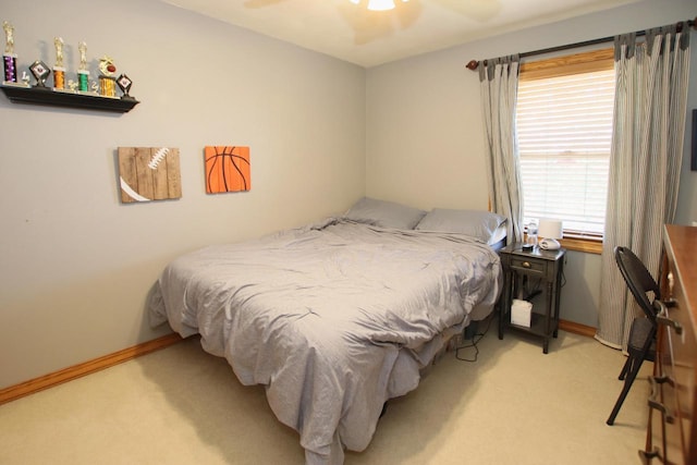 bedroom featuring ceiling fan and light colored carpet