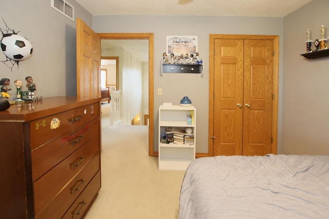 carpeted bedroom featuring a closet