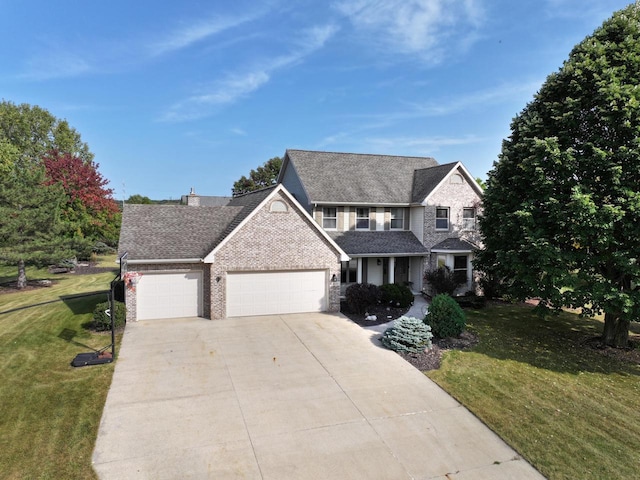 view of front of home featuring a front lawn and a garage