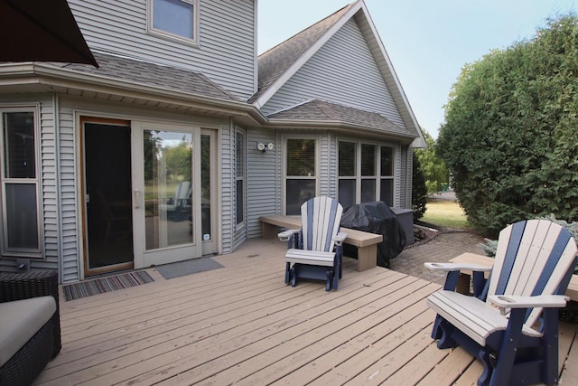 wooden terrace with area for grilling