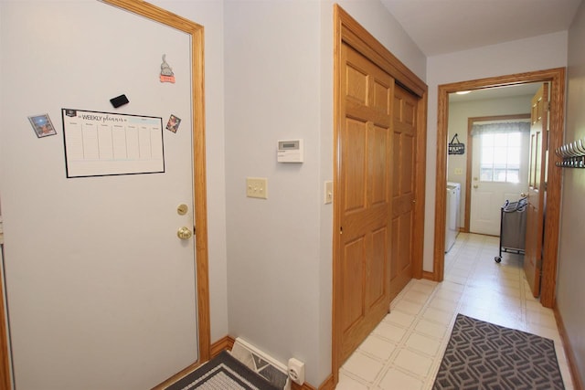 doorway to outside with washer / clothes dryer