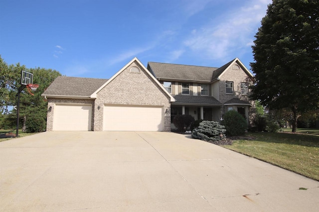 view of front of house featuring a garage and a front yard