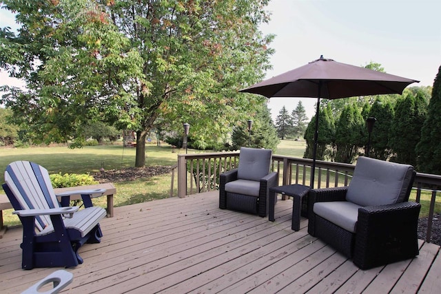 wooden terrace featuring a yard