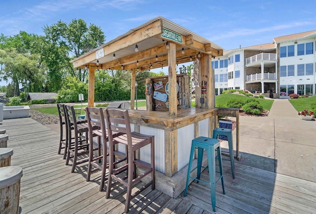 wooden deck featuring an outdoor bar