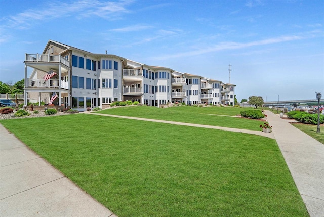 view of property's community with a yard