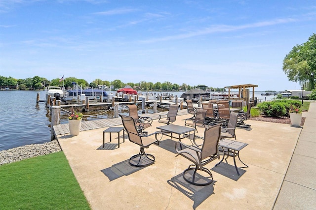 view of patio / terrace with a water view and a dock