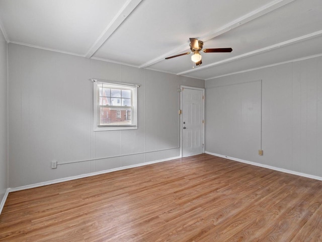 unfurnished room featuring ceiling fan, beamed ceiling, light hardwood / wood-style floors, and ornamental molding