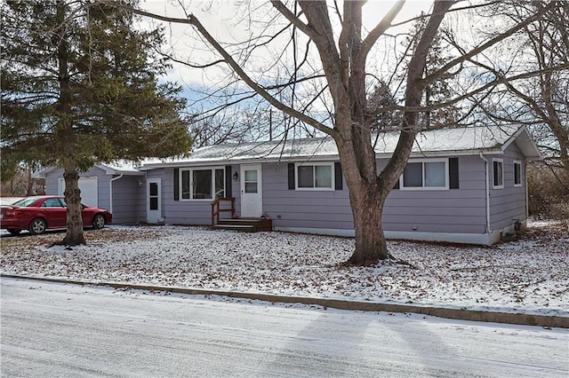 single story home with a garage