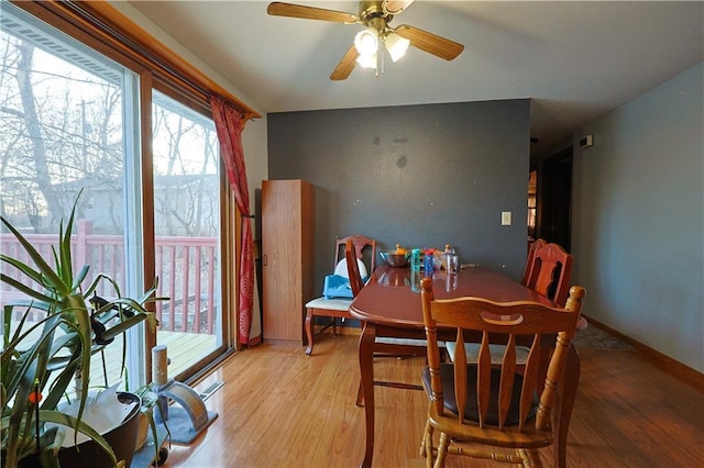 dining room featuring ceiling fan and light wood-type flooring