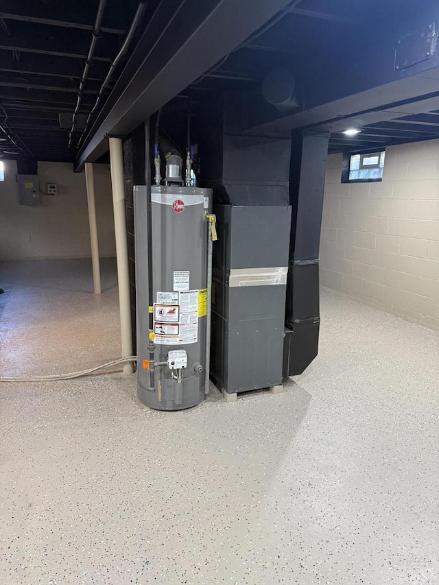 basement with electric panel, heating unit, and water heater