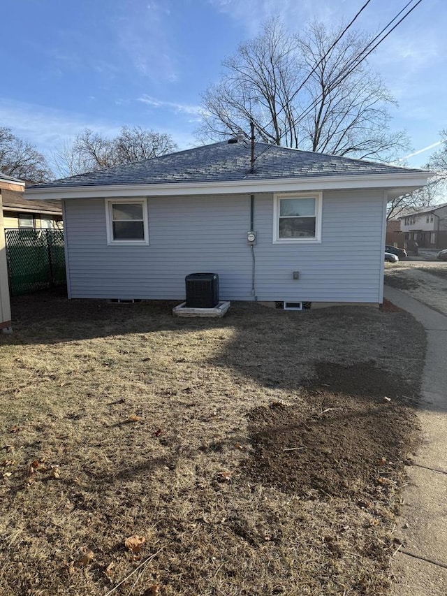 rear view of property with central AC unit