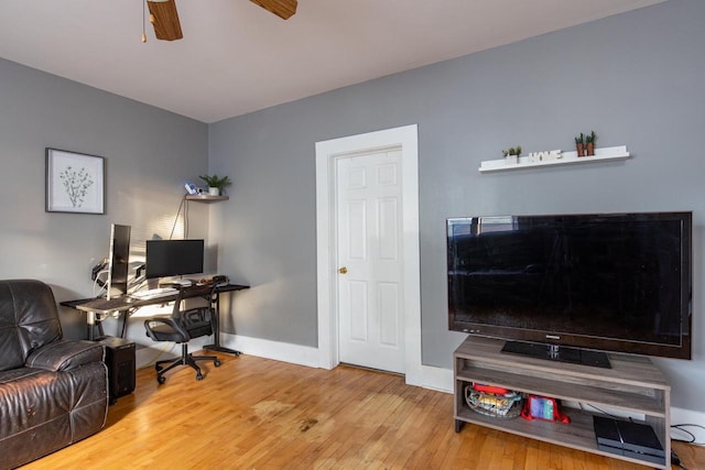 office featuring hardwood / wood-style flooring and ceiling fan