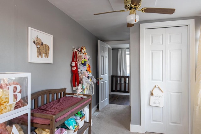 carpeted dining room featuring ceiling fan