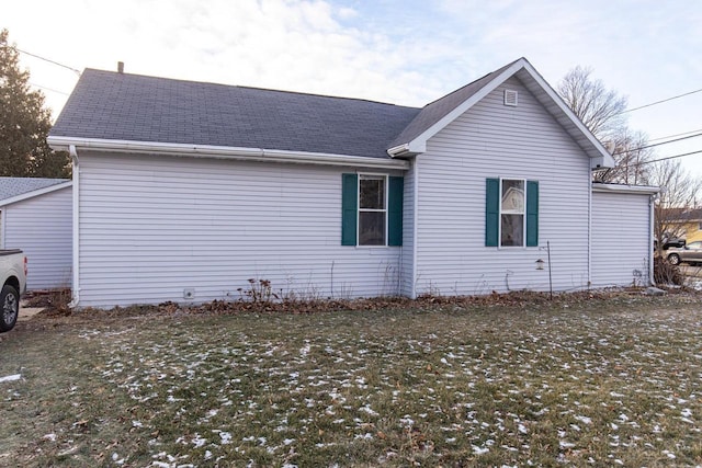 view of property exterior featuring a yard