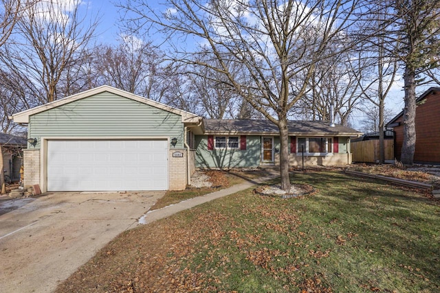 single story home with a front yard and a garage