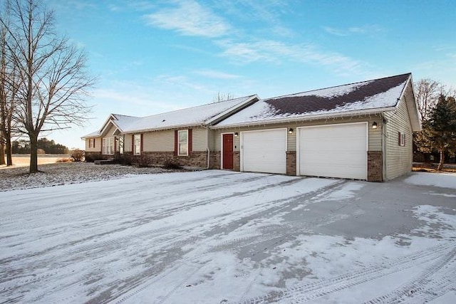 ranch-style home featuring a garage