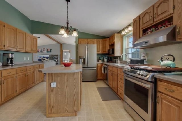 kitchen with vaulted ceiling with beams, stainless steel appliances, sink, decorative light fixtures, and a center island