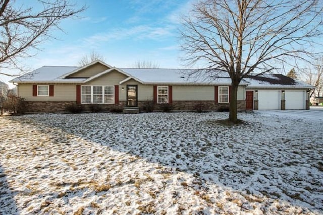 ranch-style home featuring a garage