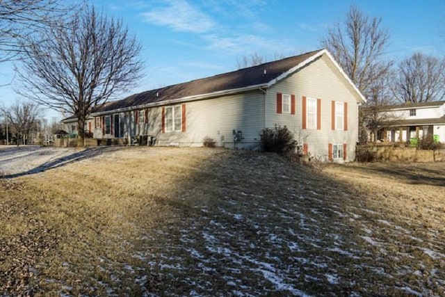 view of home's exterior featuring a yard