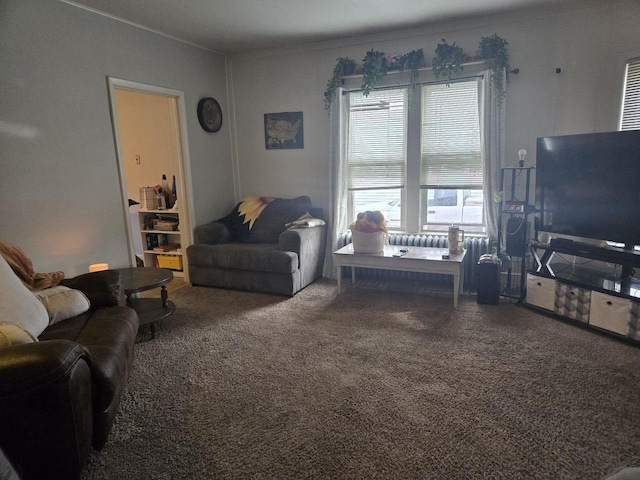 carpeted living room featuring crown molding