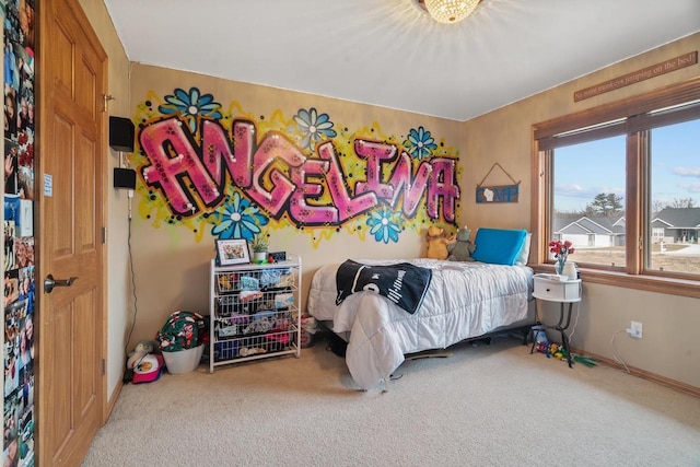 carpeted bedroom with baseboards