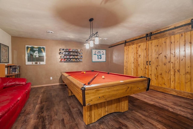 game room with a barn door, baseboards, wood finished floors, and pool table