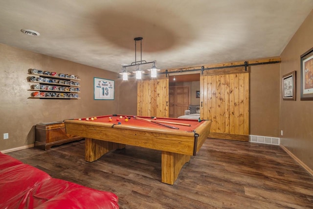 playroom with dark hardwood / wood-style floors, a barn door, and pool table