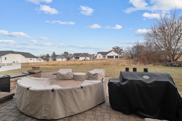 view of patio / terrace featuring a residential view, area for grilling, and fence