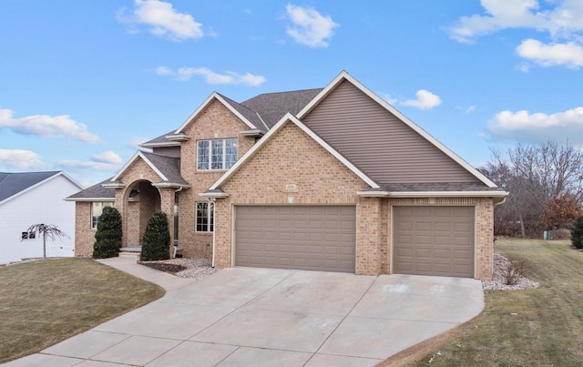 view of front of home featuring a garage, brick siding, concrete driveway, and a front lawn