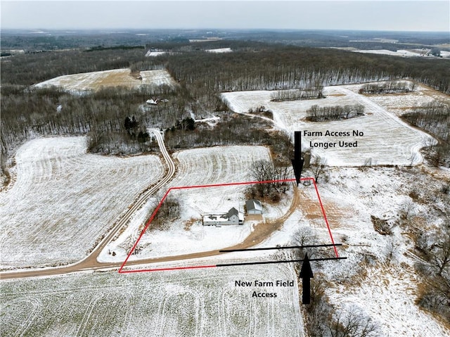 snowy aerial view with a rural view