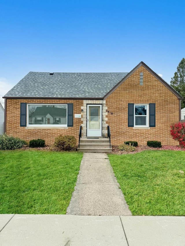 ranch-style home with a front lawn