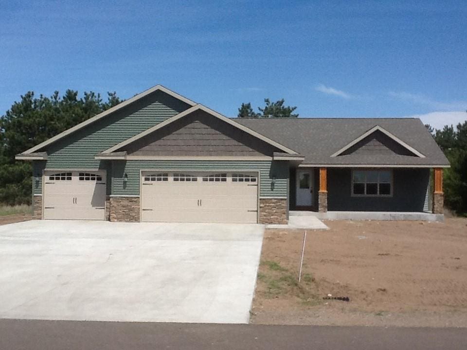 craftsman inspired home with a garage