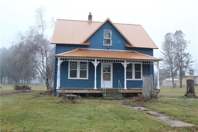 view of front of home featuring covered porch and a front lawn