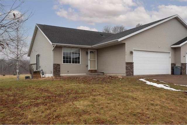 view of front of home featuring a garage and a front lawn