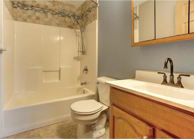 full bathroom featuring shower / bathing tub combination, vanity, and toilet