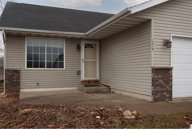 property entrance with a garage