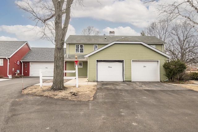 front of property with a garage