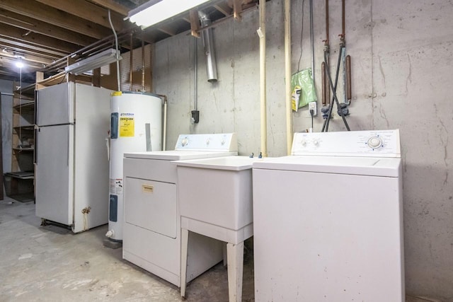 laundry area featuring separate washer and dryer and water heater