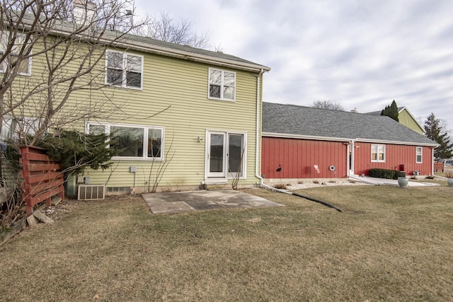 back of house featuring a lawn and a patio