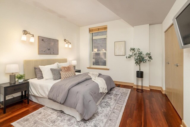 bedroom featuring dark hardwood / wood-style floors