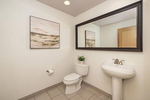 bathroom featuring toilet and tile patterned floors